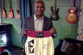 Evander Holyfield with Eruption boxing trunks